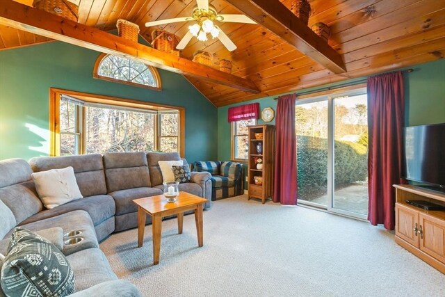 carpeted living room featuring vaulted ceiling with beams, wood ceiling, and a ceiling fan