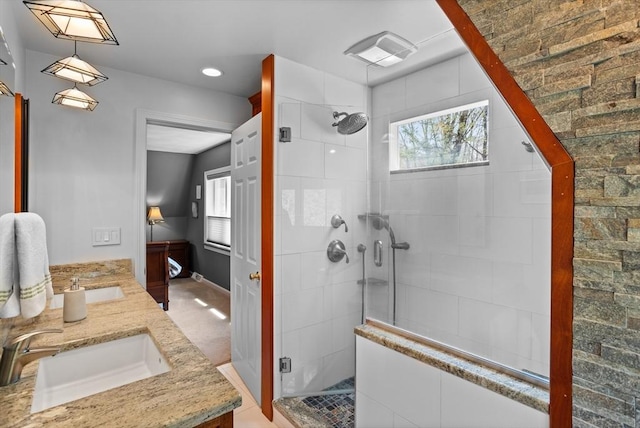 full bath with plenty of natural light, a sink, and a stall shower