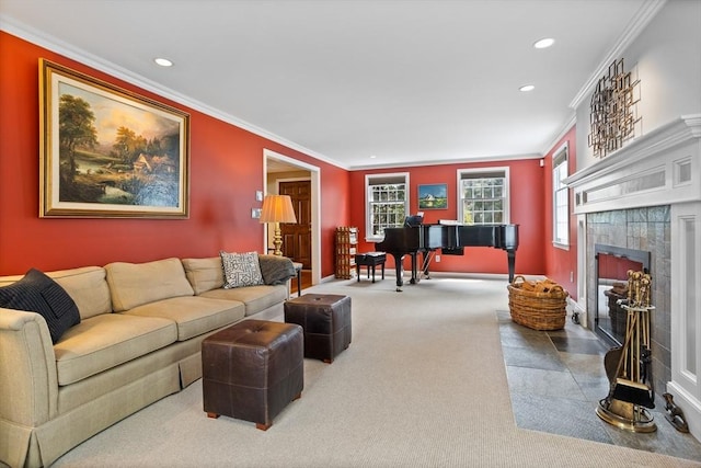 carpeted living room with baseboards, ornamental molding, a fireplace, and recessed lighting