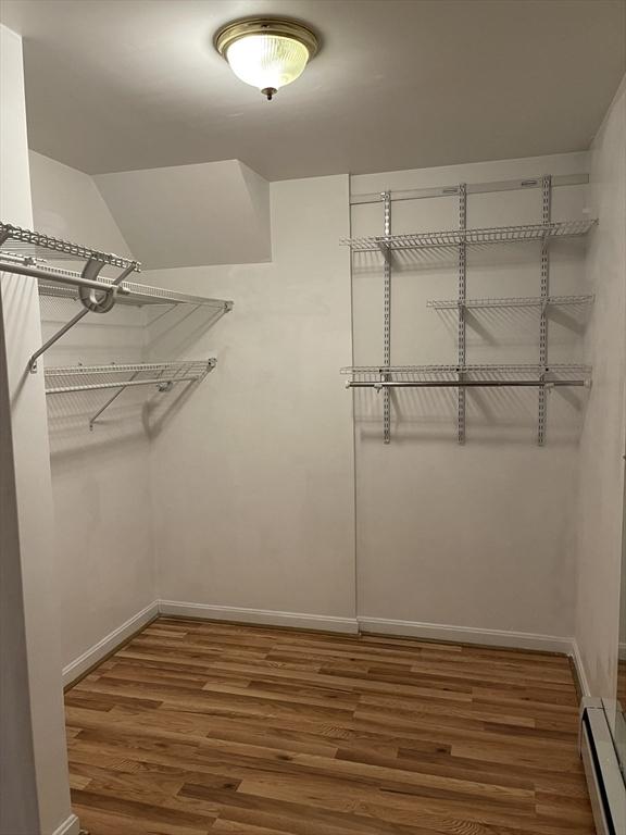 24A Outlook Dr Unit A, Worcester, MA 01602 - spacious closet with a baseboard heating unit and wood finished floors