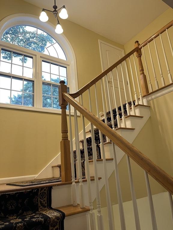 24A Outlook Dr Unit A, Worcester, MA 01602 - stairway featuring a chandelier