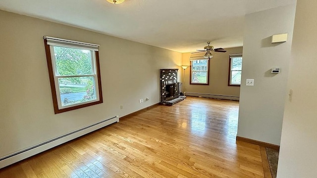 61 Bernice Ave, Leominster, MA 01453 - spare room featuring a baseboard heating unit, baseboard heating, light wood-type flooring, and a ceiling fan