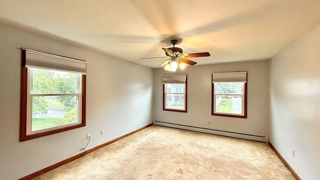 61 Bernice Ave, Leominster, MA 01453 - unfurnished room featuring a baseboard radiator, light carpet, and a ceiling fan