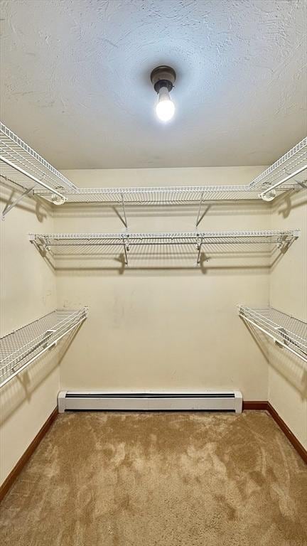 61 Bernice Ave, Leominster, MA 01453 - walk in closet featuring carpet floors and a baseboard heating unit