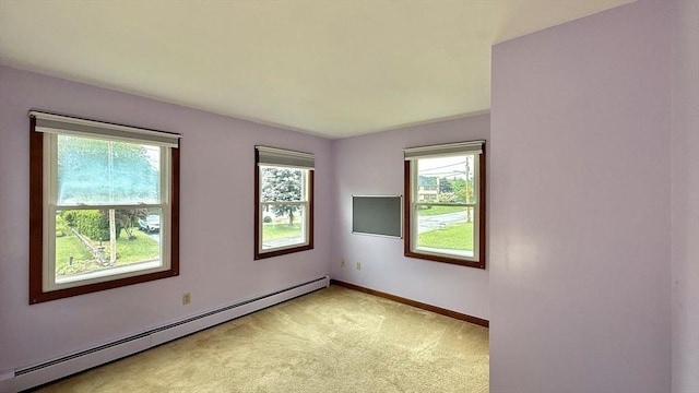 61 Bernice Ave, Leominster, MA 01453 - spare room featuring a baseboard heating unit and light carpet
