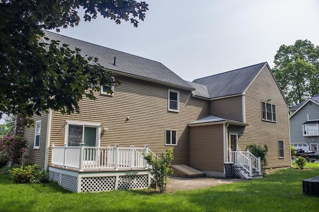 61 Bernice Ave, Leominster, MA 01453 - back of property with a yard and a deck