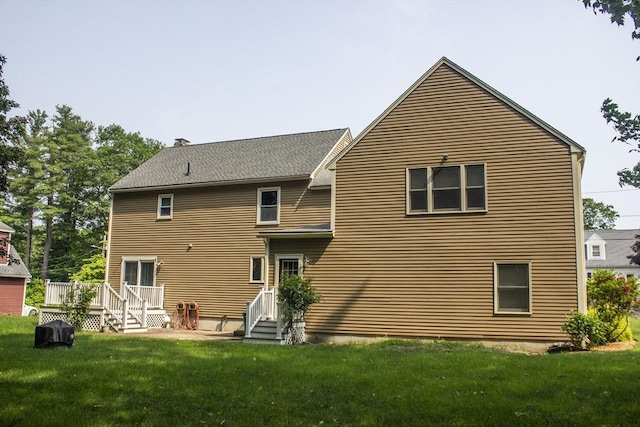 61 Bernice Ave, Leominster, MA 01453 - rear view of house featuring a lawn, a wooden deck, and entry steps