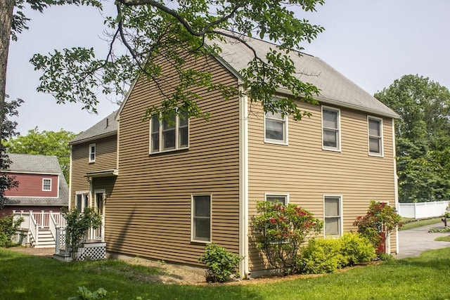 61 Bernice Ave, Leominster, MA 01453 - view of home's exterior featuring a lawn