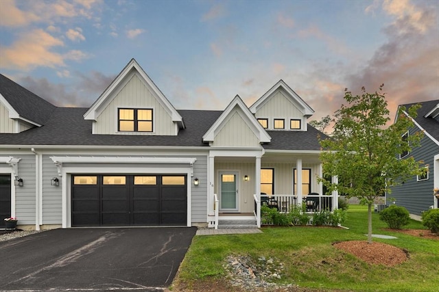 16 Primrose Ln Unit 16, Ipswich, MA 01938 - view of front of property featuring a porch, asphalt driveway, a lawn, board and batten siding, and a shingled roof