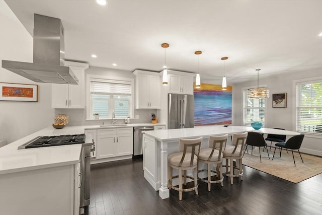 16 Primrose Ln Unit 16, Ipswich, MA 01938 - kitchen with appliances with stainless steel finishes, exhaust hood, recessed lighting, light countertops, and white cabinets