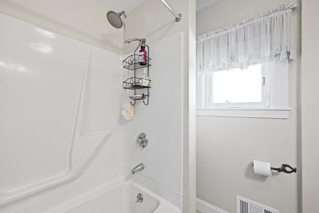 full bath featuring baseboards, bathtub / shower combination, and visible vents