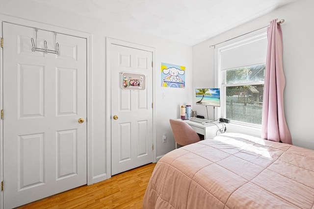 bedroom featuring light wood-style floors