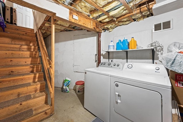 clothes washing area featuring laundry area, visible vents, and washing machine and dryer