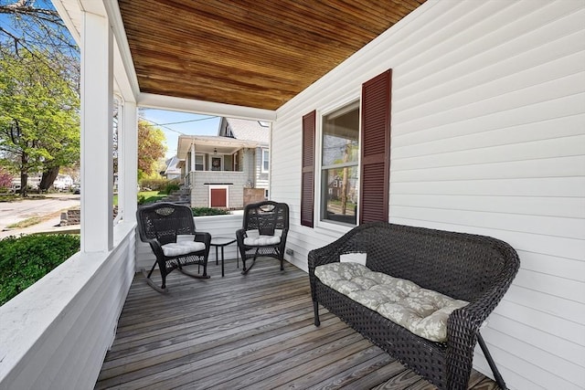 wooden terrace featuring a porch