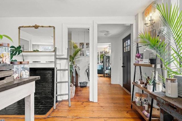 interior space featuring light wood-type flooring and a fireplace