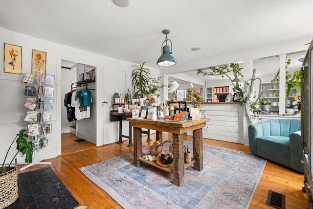interior space with visible vents and hardwood / wood-style flooring