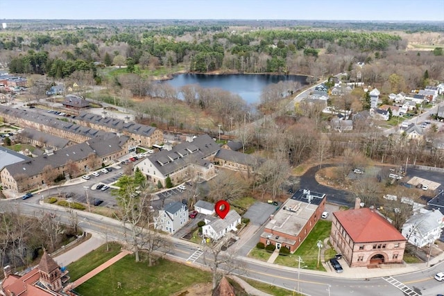 aerial view featuring a water view and a view of trees