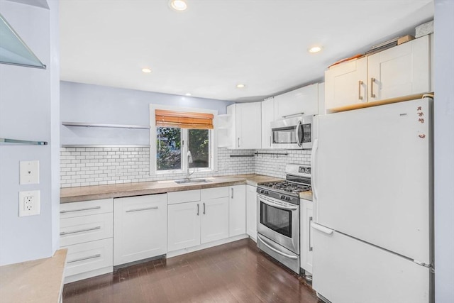 19 Doane Unit 1, Lowell, MA 01851 - kitchen featuring stainless steel appliances, open shelves, a sink, white cabinets, and recessed lighting