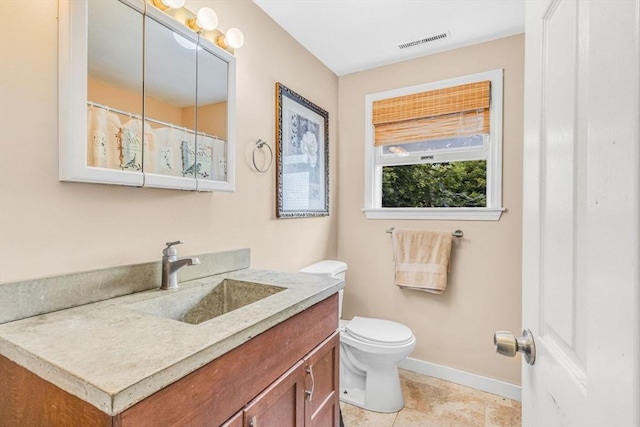 19 Doane Unit 1, Lowell, MA 01851 - full bath with baseboards, vanity, toilet, and tile patterned floors
