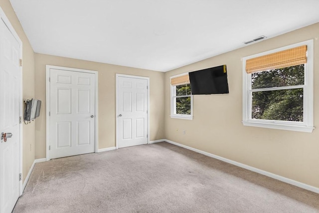 19 Doane Unit 1, Lowell, MA 01851 - unfurnished bedroom with carpet flooring and baseboards