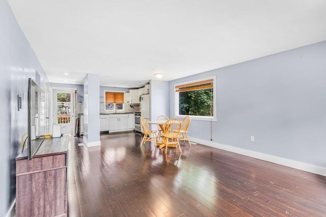 19 Doane Unit 1, Lowell, MA 01851 - dining area featuring baseboards and dark wood-type flooring