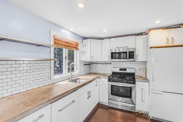 19 Doane Unit 1, Lowell, MA 01851 - kitchen featuring stainless steel appliances, a sink, open shelves, white cabinets, and recessed lighting