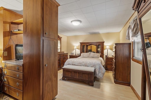 bedroom with light wood finished floors