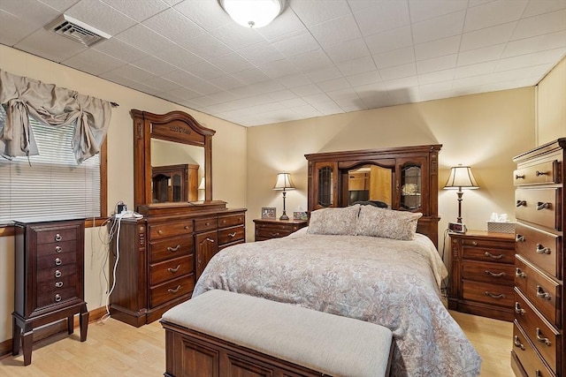 bedroom featuring light wood-style floors