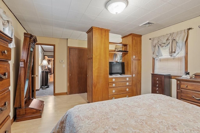bedroom with light wood-type flooring
