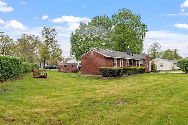 view of home's exterior featuring a yard