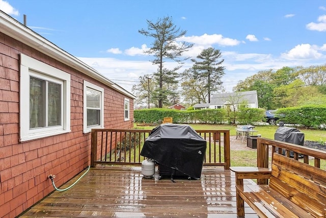 wooden terrace featuring grilling area