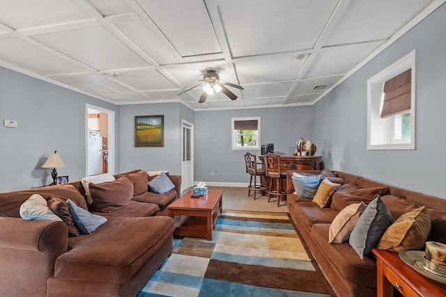 living room featuring a ceiling fan and baseboards