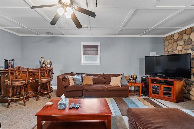 carpeted living area with ceiling fan and a dry bar
