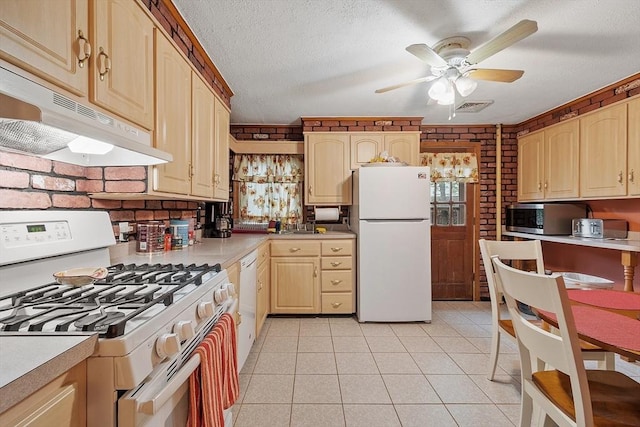 kitchen featuring white appliances, under cabinet range hood, light brown cabinetry, ceiling fan, and light countertops