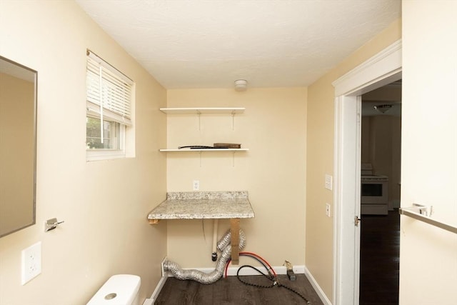 139 Endicott St, Worcester, MA 01610 - laundry area with wood finished floors and baseboards