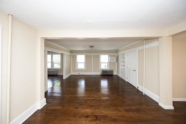 139 Endicott St, Worcester, MA 01610 - unfurnished living room featuring radiator, baseboards, and wood finished floors