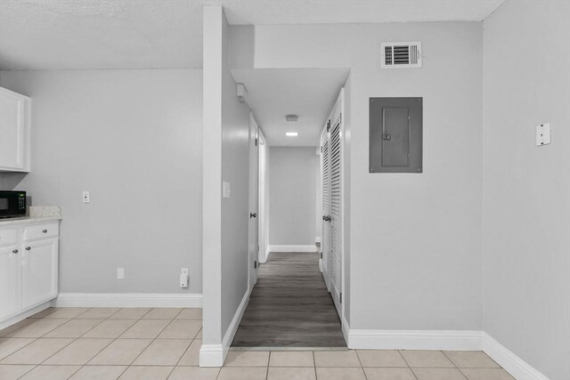 239 Glasgow St Unit 12, Fall River, MA 02721 - hallway with electric panel and light tile patterned flooring
