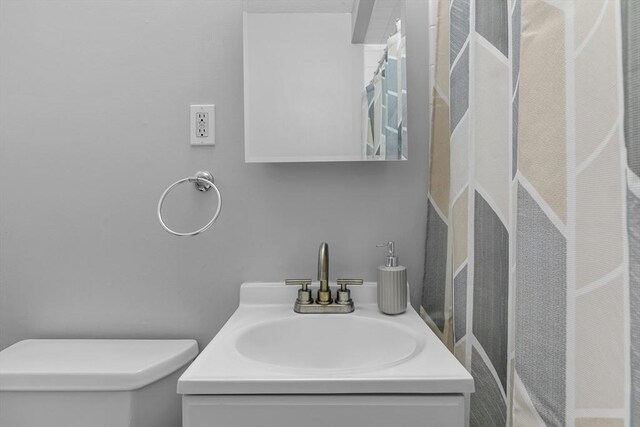 239 Glasgow St Unit 12, Fall River, MA 02721 - bathroom with toilet and vanity