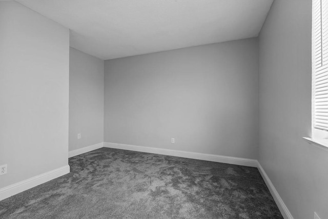 239 Glasgow St Unit 12, Fall River, MA 02721 - empty room with dark colored carpet and baseboards