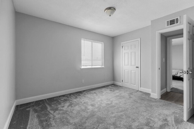 239 Glasgow St Unit 12, Fall River, MA 02721 - unfurnished bedroom featuring carpet and baseboards