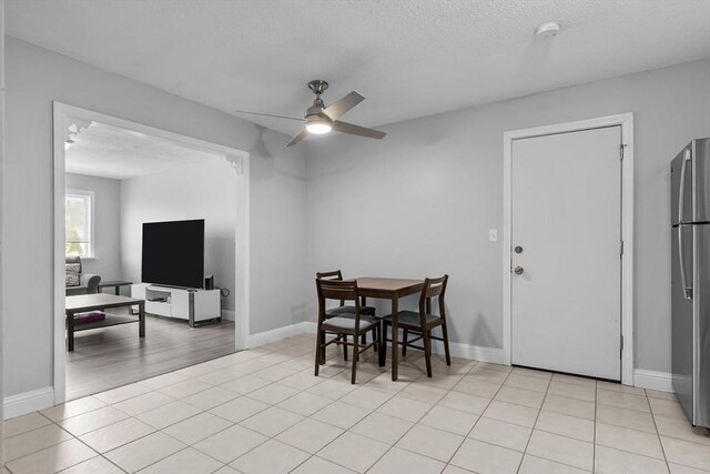 239 Glasgow St Unit 12, Fall River, MA 02721 - dining space featuring ceiling fan, a textured ceiling, and light tile patterned floors