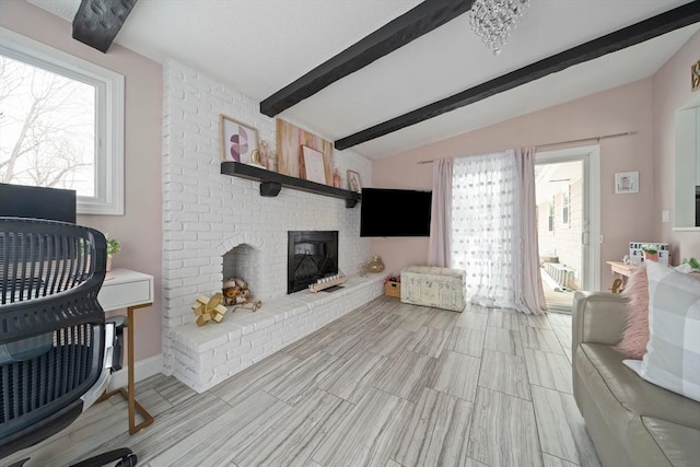 living room featuring vaulted ceiling with beams and a fireplace