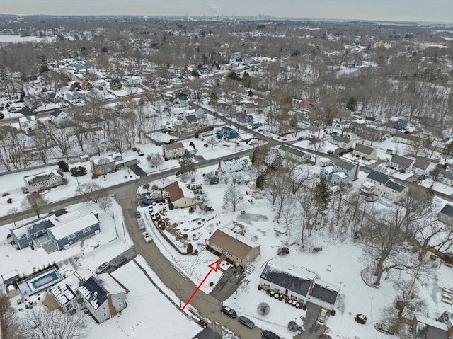 snowy aerial view with a residential view