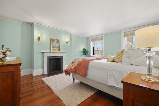 101 Pinckney St, Boston, MA 02114 - bedroom featuring baseboards, wood finished floors, and a fireplace