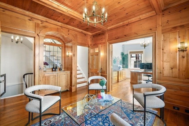 101 Pinckney St, Boston, MA 02114 - living area with wood ceiling, wood walls, wood finished floors, and a chandelier