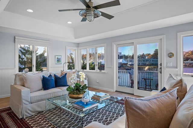 living room with hardwood / wood-style flooring and ceiling fan