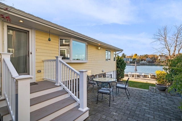 view of patio featuring a water view