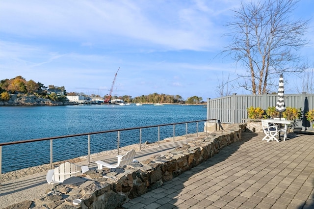 view of patio with a water view