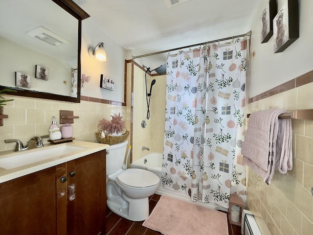 full bathroom with vanity, tile walls, shower / bath combination with curtain, and baseboard heating