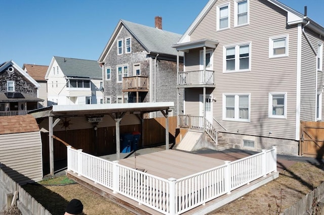 back of property with a balcony